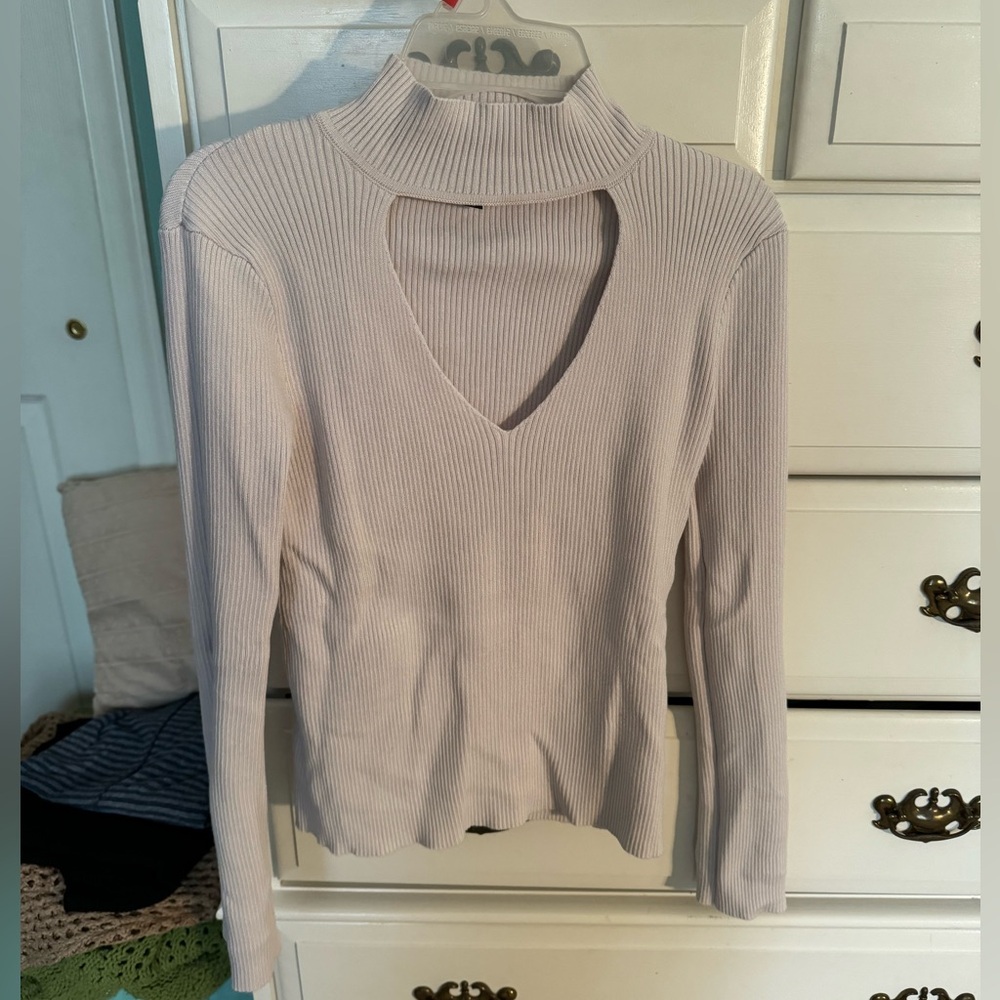 cream ribbed turtle neck. great for layering or statement top